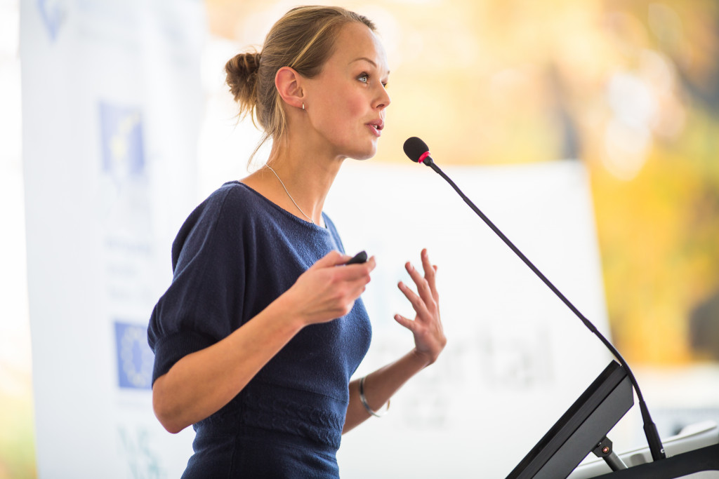 woman speaking in an open mic event