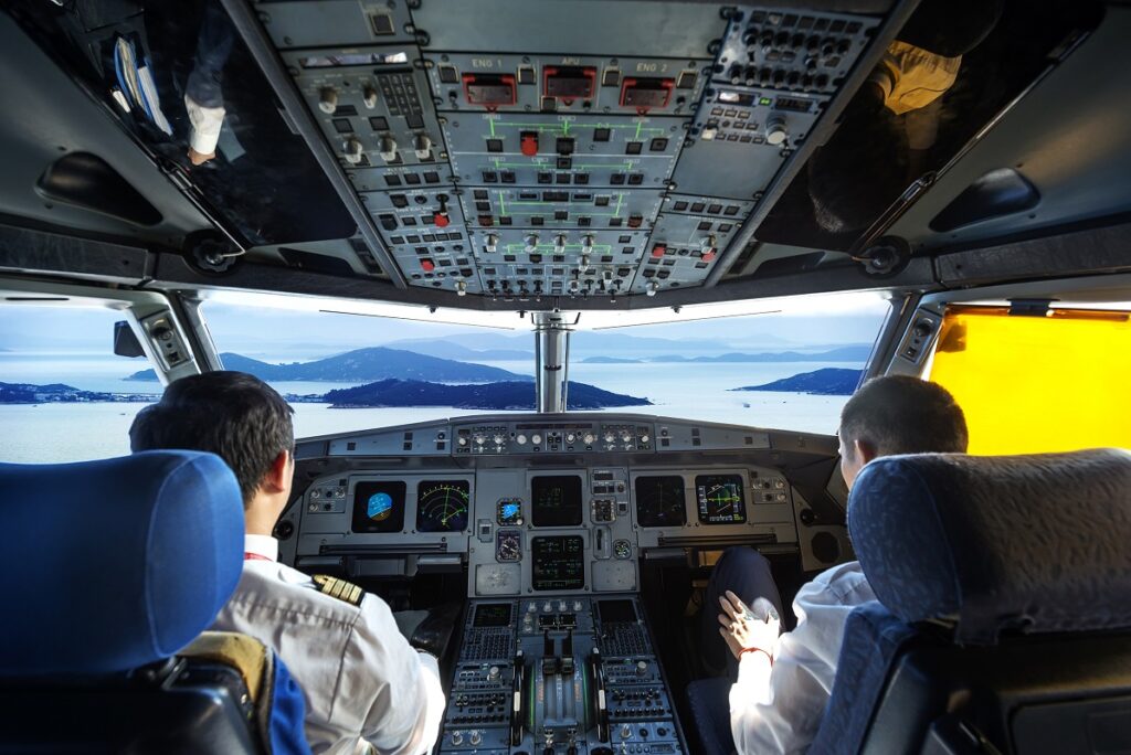 pilots in the plane cockpit