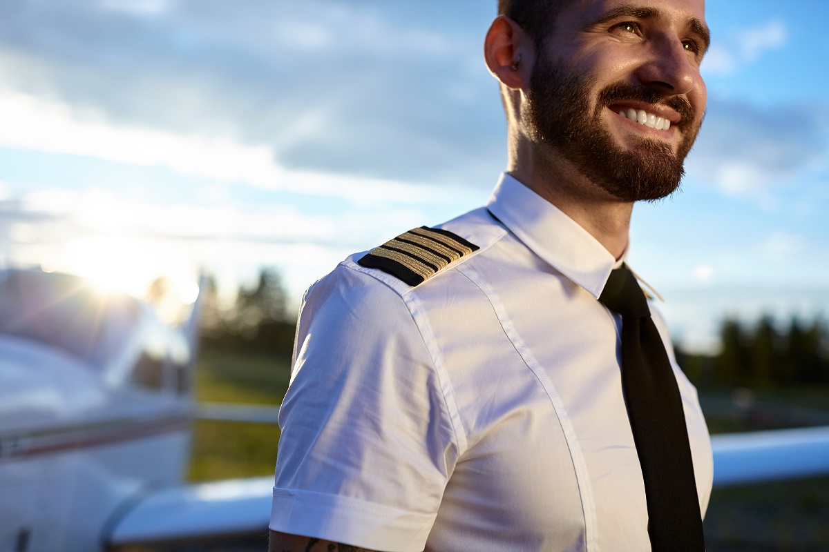 a handsome pilot smiling