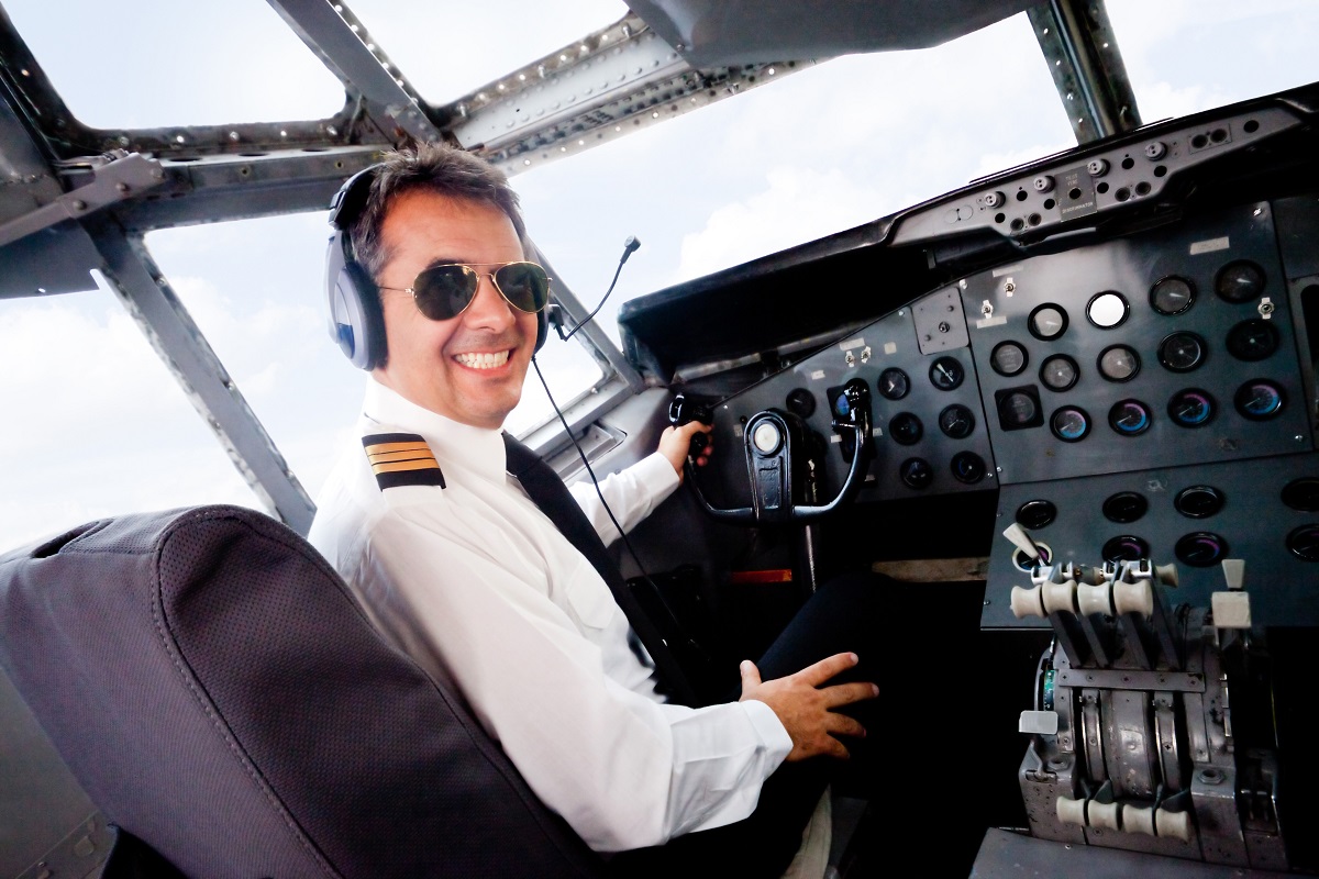 pilot wearing a sunglasses and smiling 