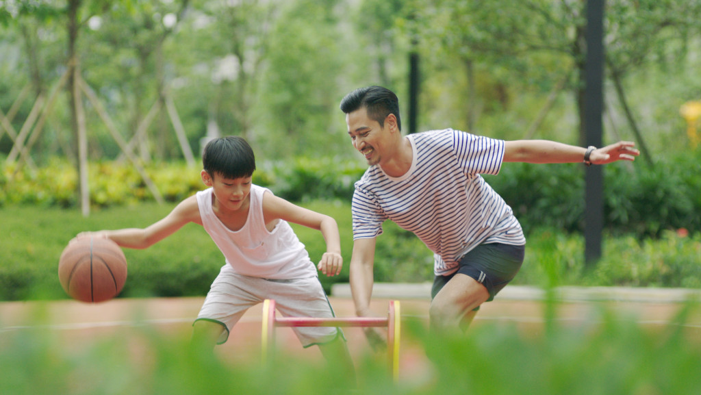 Child playing with father